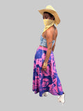 Side view of model wearing Black Herstory midi skirt with purple collage print and flared hem