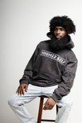 Higher Self Hoodie, Model in chair