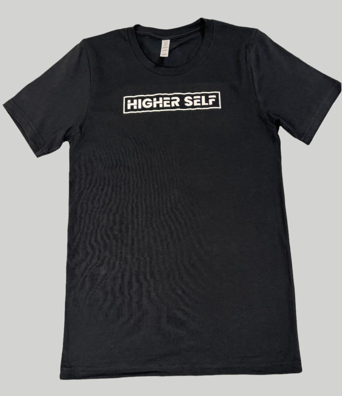 Black unisex t-shirt with screen-printed HIGHERself design by Soul Seed Apparel, 100% combed ring-spun cotton, tear-away label, shoulder-to-shoulder taping.