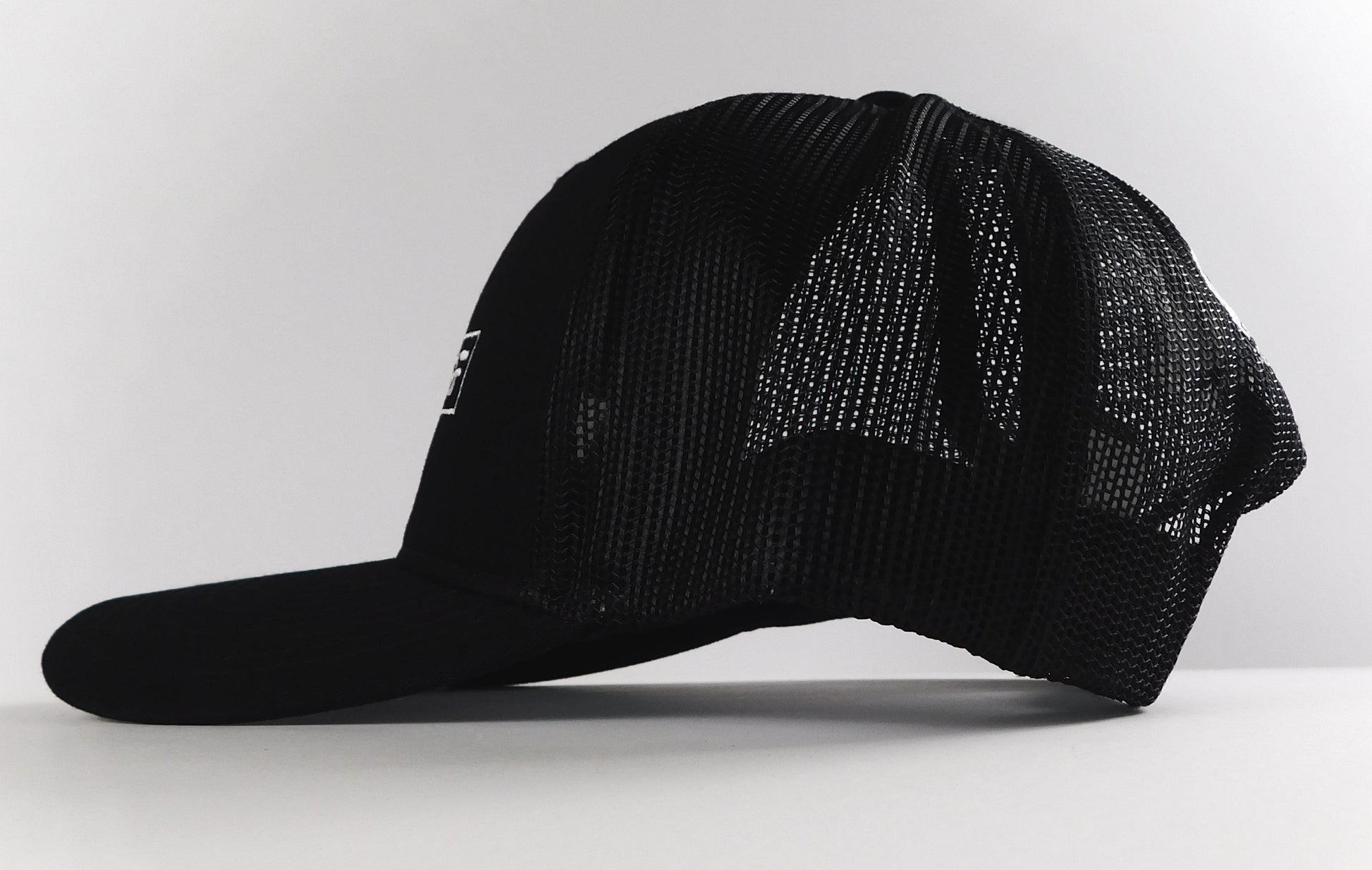 All-black Higher Self trucker hat with mesh back - spiritual empowerment snapback accessory by SoulSeed Apparel