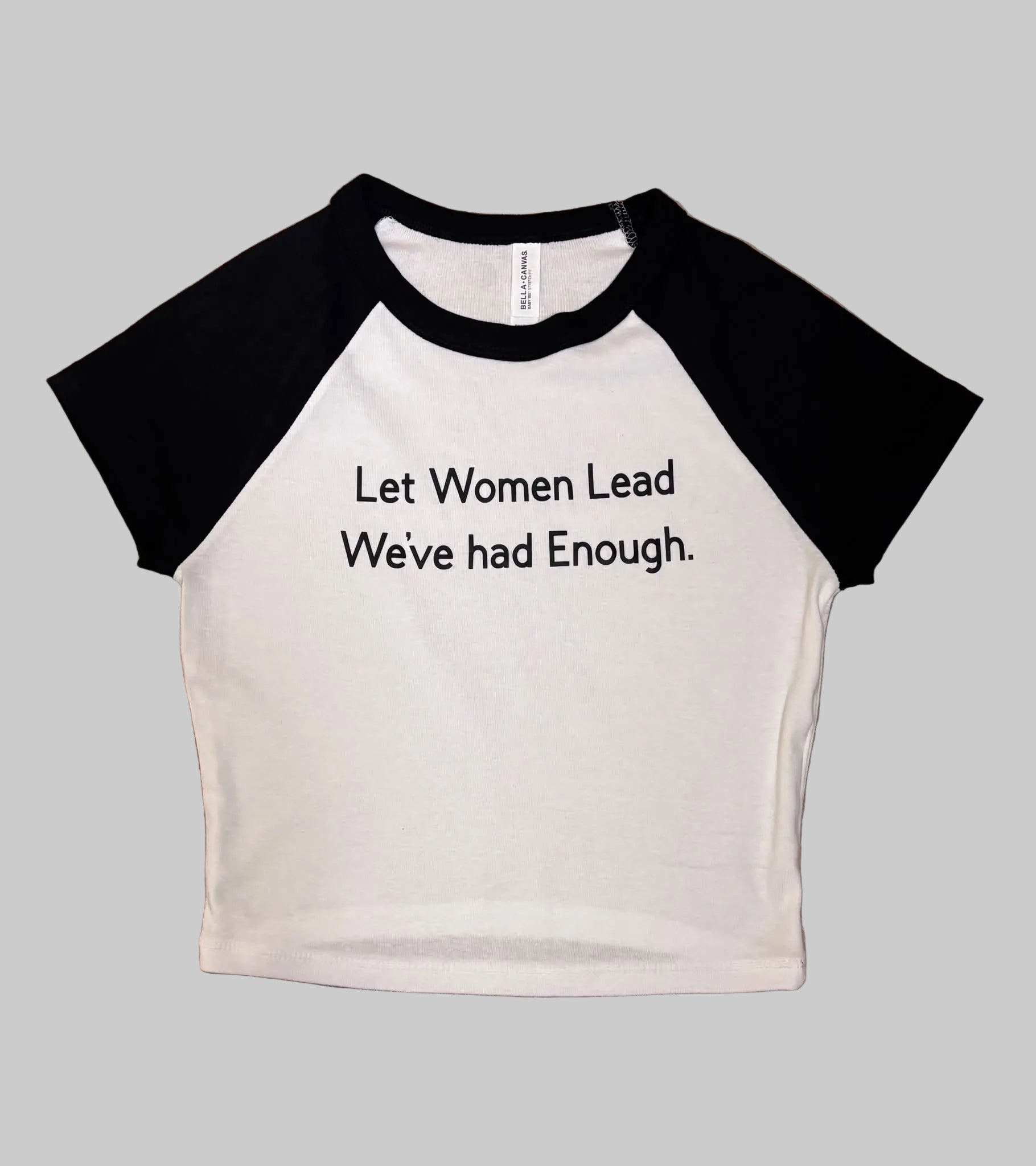 Black t-shirt featuring the bold statement "Let Women Lead, We've Had Enough" in large, easy-to-read lettering. A conversation-starting design inspired by the idea of empowering women in leadership and reimagining traditional power structures.